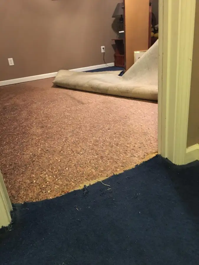 Carpet pad removal revealing water damage during Water Mitigation Services in Citrus Heights